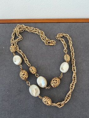 Vintage 1928 gold tone faux pearl long necklace